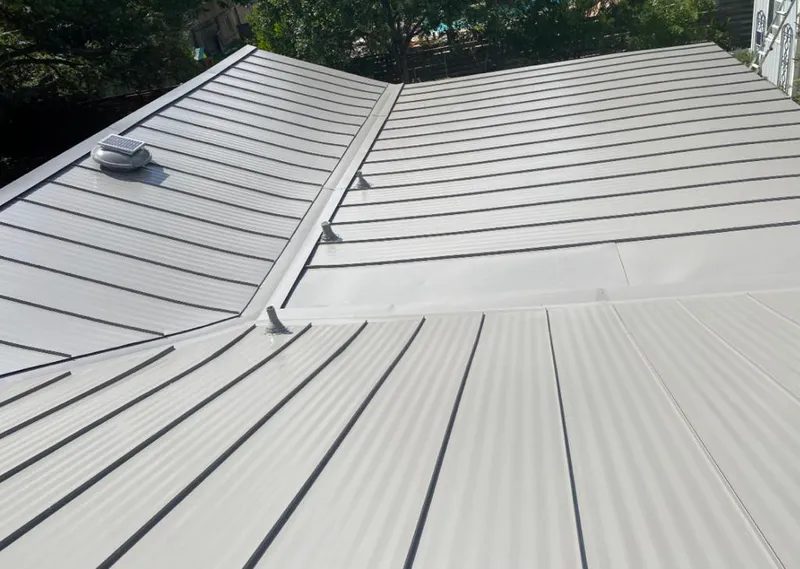 Solar attic fan installed on a metal roof for Roof Ventilation in Talent